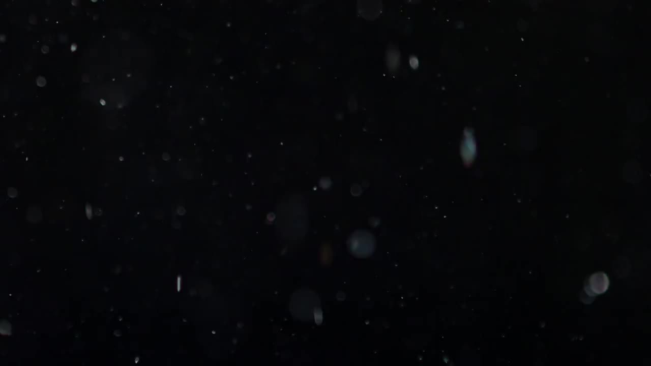 雪或灰尘颗粒向下滴落特效视频