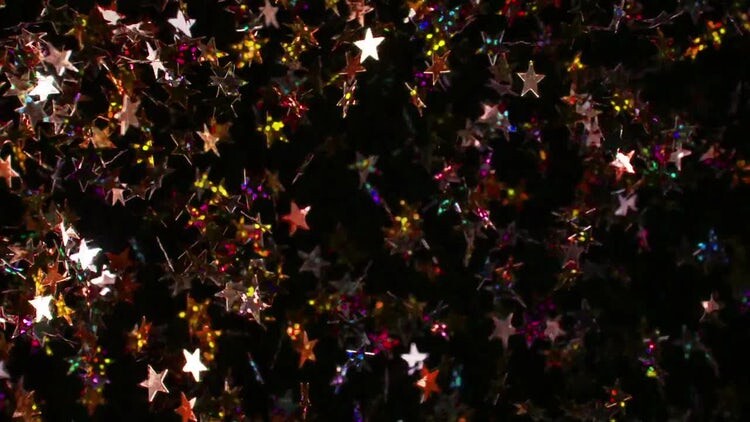 黑色背景下漂浮彩色星星视频素材